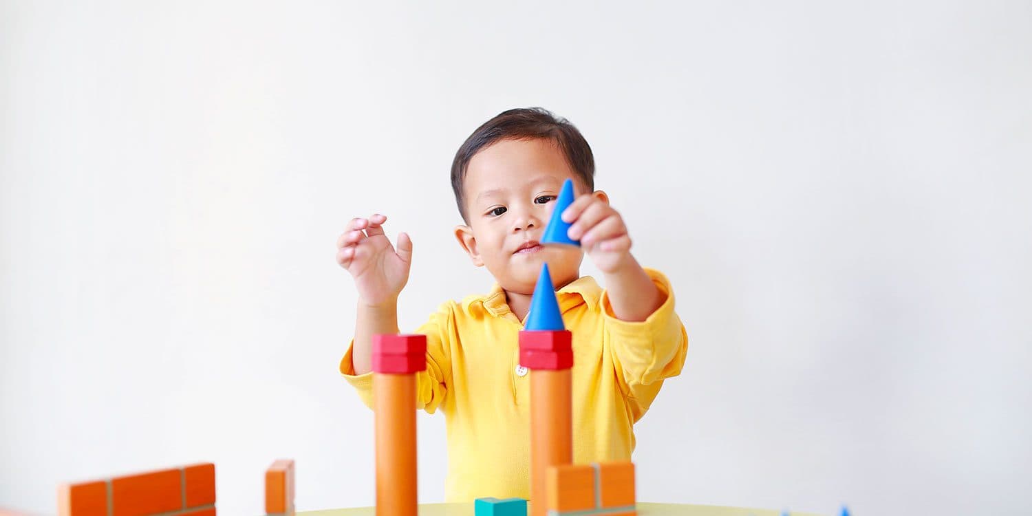 A teacher engaging children in a classroom activity
